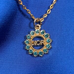 Beautiful Upcycled Christian Dior charm on 18” gold plated chain
